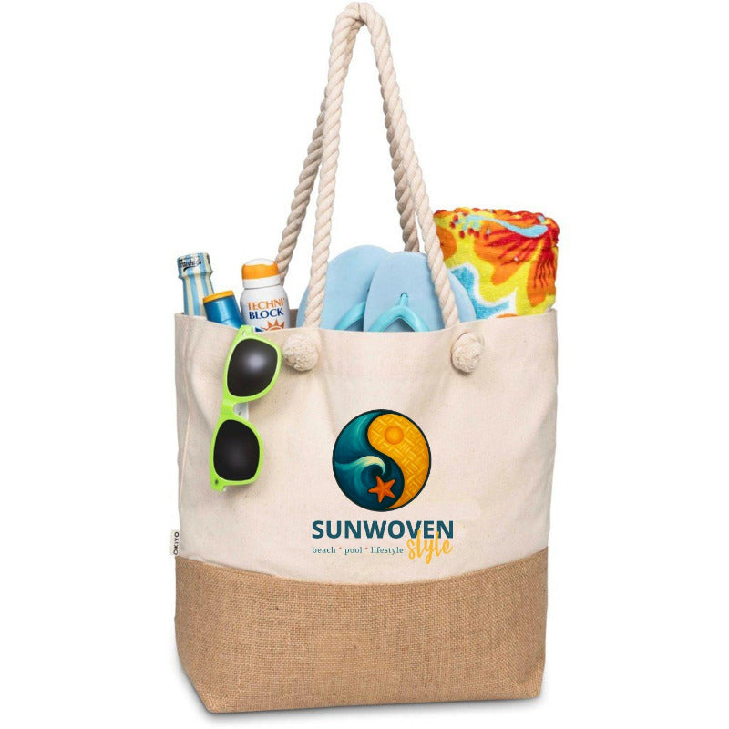 Beige tote bag with jute bottom, sunglasses, flip-flops, and a bottle of sunscreen on a white background.
