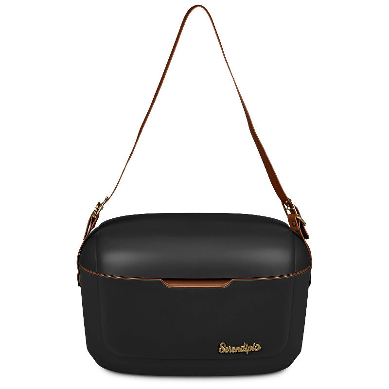 Black hard plastic cooler box with long tan vegan leather strap on white background